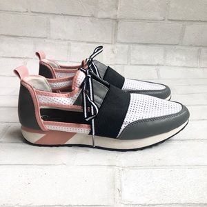 Pink white and black tennis shoes, sneakers with cut out sides